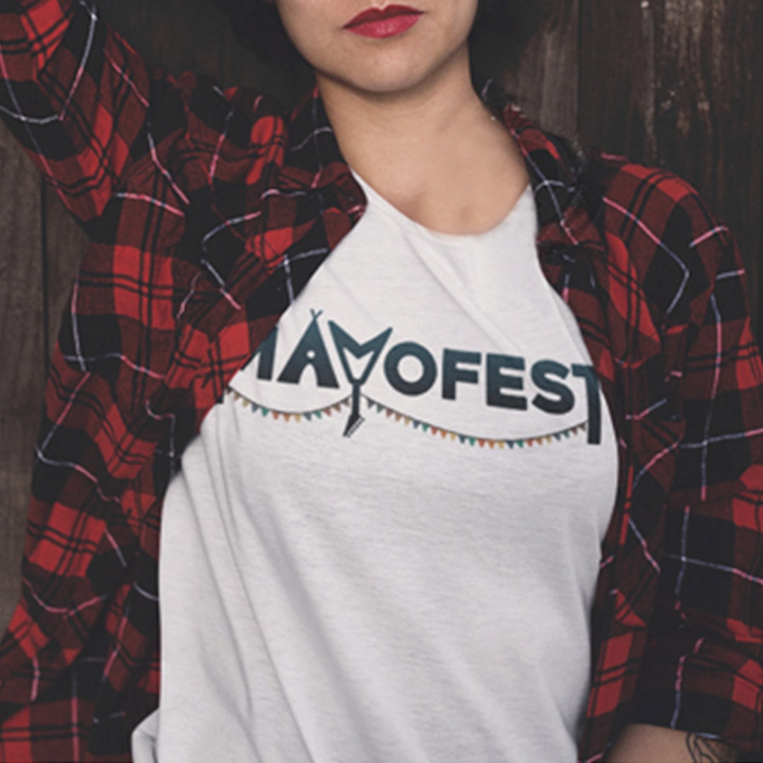 young woman wearing a shirt with the Mayofest logo on it.