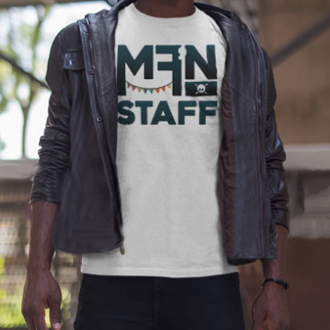 a young man wearing a MFN staff shirt.